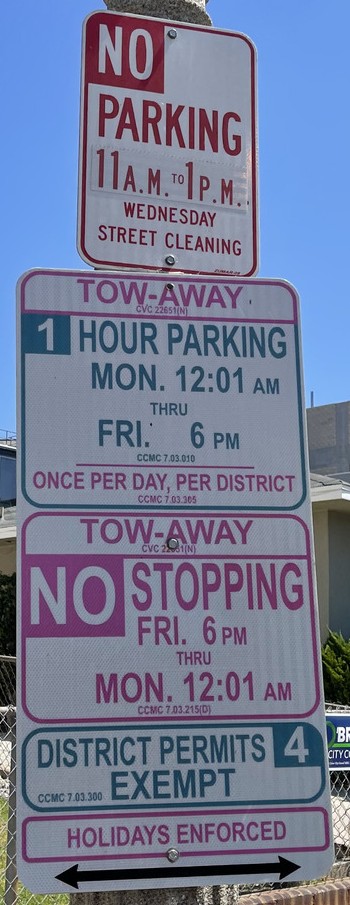 No parking 11 AM–1 PM Wednesday. Street cleaning. Tow-away. 1 hour parking Monday 12:01 AM through Friday 6 PM. Once per day, per district. Tow-away. No stopping Friday 6 PM through Monday 12:01 AM. District permits 4 exempt. Holidays enforced. Arrows point both ways.